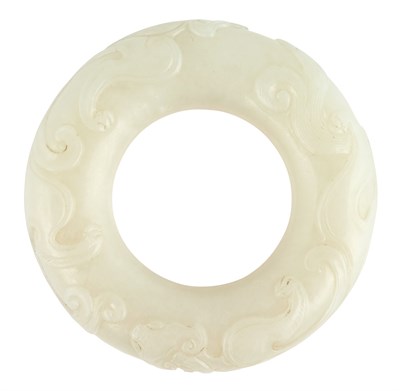 Lot 47 - A Chinese Carved White Jade Ring With...