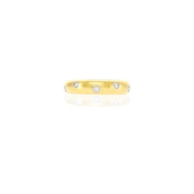 Lot 1039 - Tiffany & Co. Gold, Platinum and Diamond 'Etoile' Band Ring