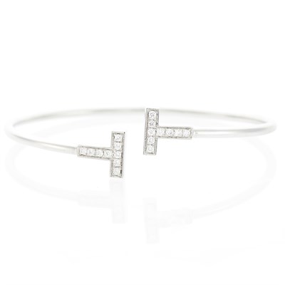 Lot 1023 - Tiffany & Co. White Gold and Diamond 'T' Bangle Bracelet