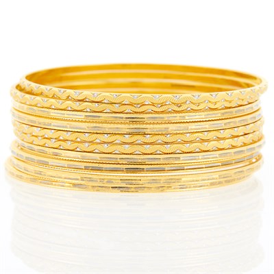 Lot 1130 - Ten Two-Color High Karat Gold Bangle Bracelets