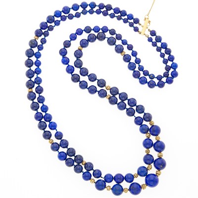 Lot 1079 - Long Double Strand Lapis Bead, Gold and Diamond Necklace