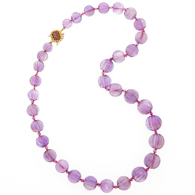 Lot 1036 - Carved Amethyst and Pink Sapphire Bead Necklace with Gold and Ruby Clasp