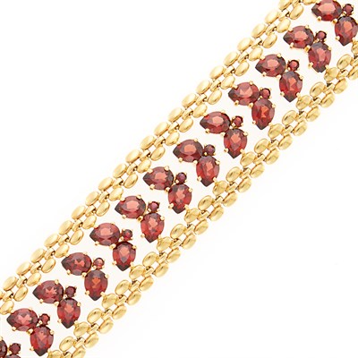 Lot 1136 - Wide Gold and Garnet Bracelet