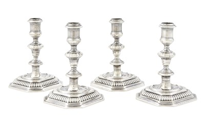 Lot 144 - Set of Four William III Sterling Silver Candlesticks