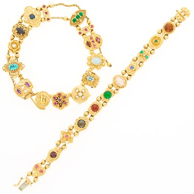 Lot 1177 - Two Gold, Low Karat Gold and Gem-Set Slide Charm Bracelets