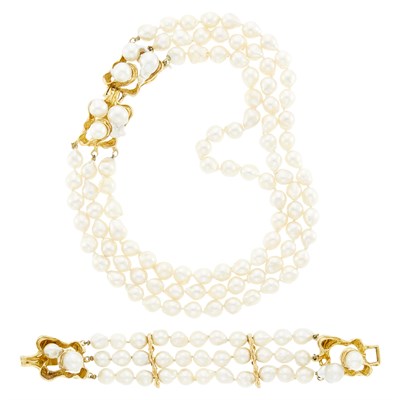 Lot 1278 - Triple Strand Baroque Cultured Pearl and Gold Necklace and Bracelet