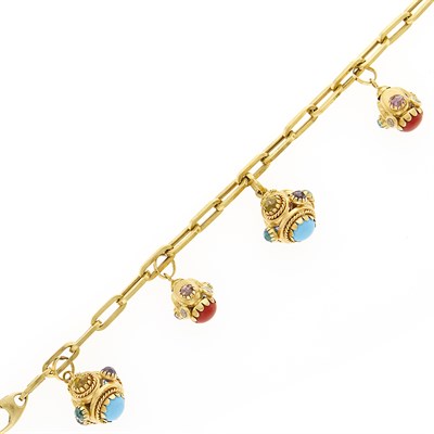 Lot 1107 - Gold, Colored Stone and Paste Charm Bracelet