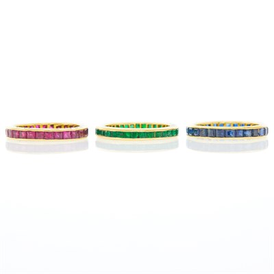 Lot 1091 - Three Gold, Sapphire, Ruby and Emerald Band Rings