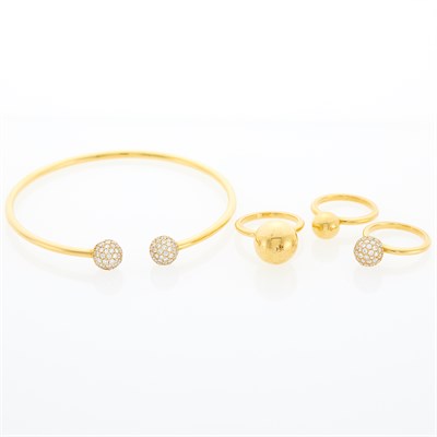 Lot 1080 - Gold and Diamond Bangle Bracelet and Three Ball Rings