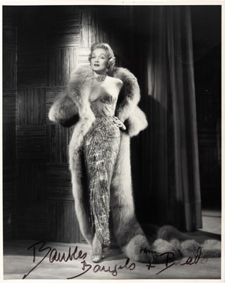 Lot 100 - DIETRICH, MARLENE Album with two photographs....