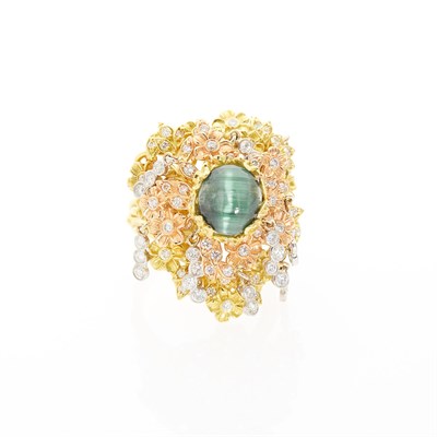 Lot 2205 - Stambolian Tricolor Gold Cat's Eye Tourmaline and Diamond Flower and Dew Drop Ring