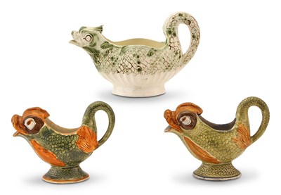 Lot 165 - Group of Three English Pearlware and Creamware Dolphin-Form Sauceboats