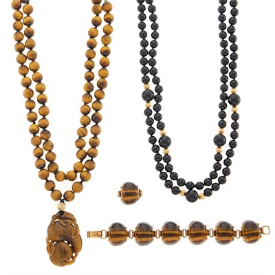 Lot 2183 - Gold and Tiger's Eye Link Bracelet, Double Strand Tiger's Eye Bead Pendant-Necklace and Black Onyx Bead Necklace