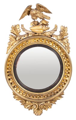 Lot 170 - Regency Part-Ebonized Giltwood Convex Mirror...