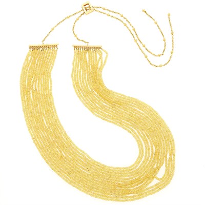 Lot 2211 - Fourteen Strand Yellow Sapphire Bead and Gold Necklace