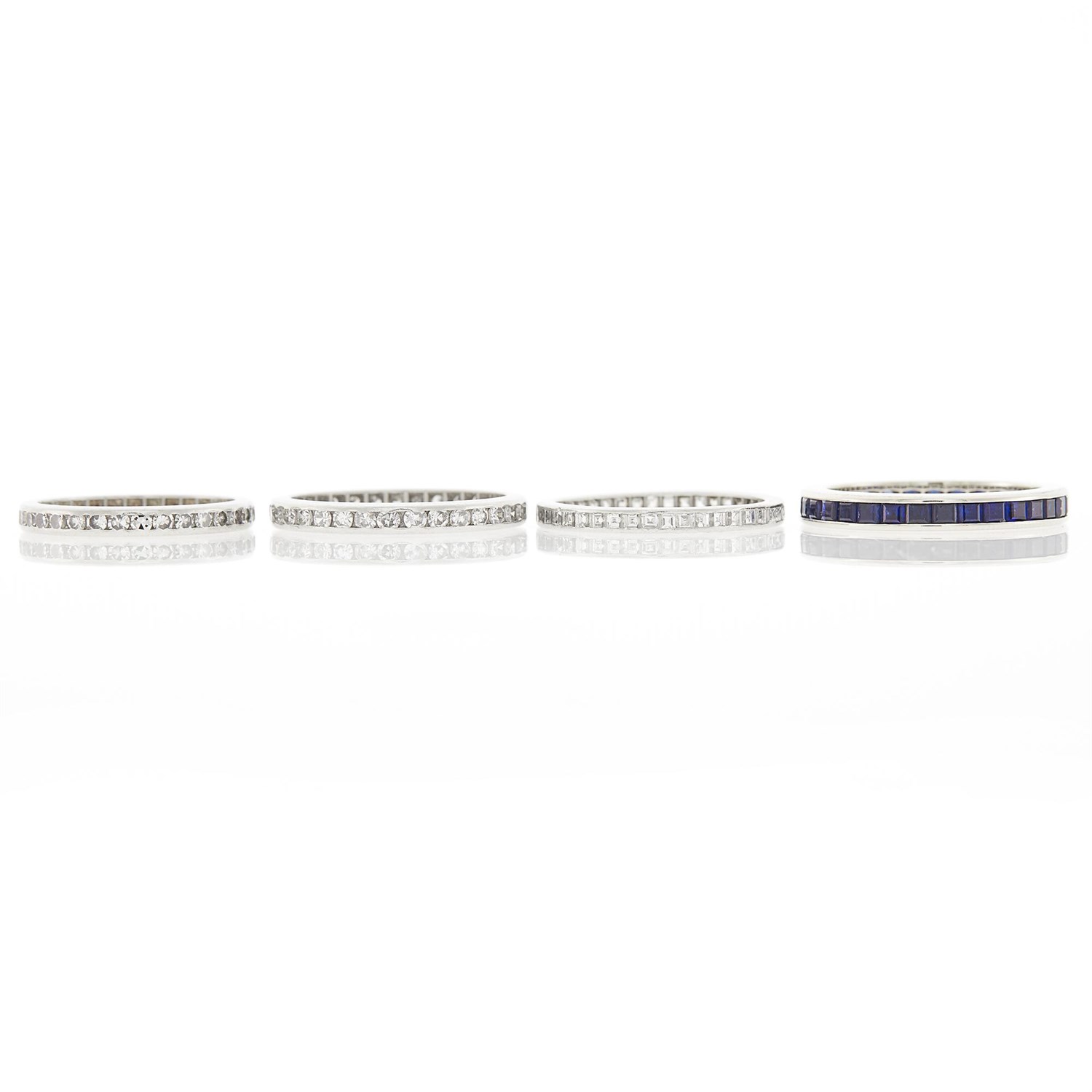 Lot 2289 - Three Platinum and Diamond Band Rings and White Gold and Sapphire Band Ring