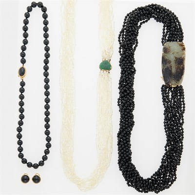 Lot 1172 - Three Black Onyx, Freshwater Pearl, Gold and Carved Jade Necklaces and Pair of Earrings