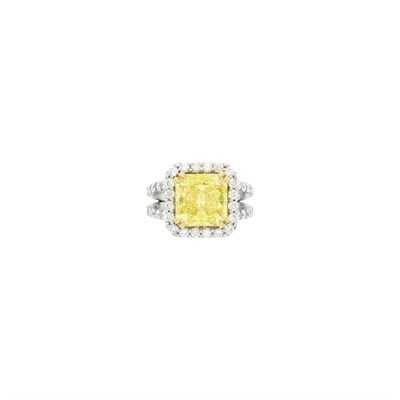 Lot 116 - Platinum, Gold, Fancy Intense Yellow Diamond and Diamond Ring