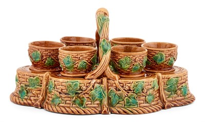 Lot 312 - Majolica Basket-Form Egg Cup Stand and Six Egg...