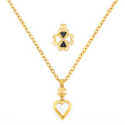 Lot 2071 - Chanel Black and White Lacquer Gilt-Metal Brooch and Mirror Heart Pendant-Necklace