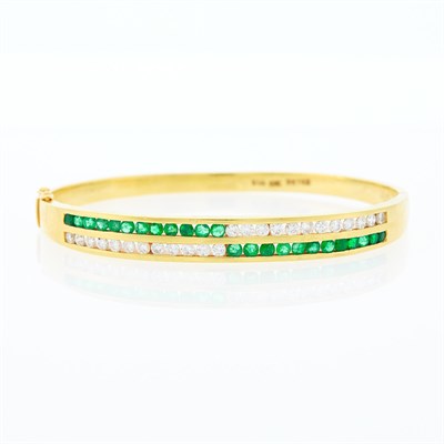 Lot 1121 - Gold, Emerald and Diamond Bangle Bracelet