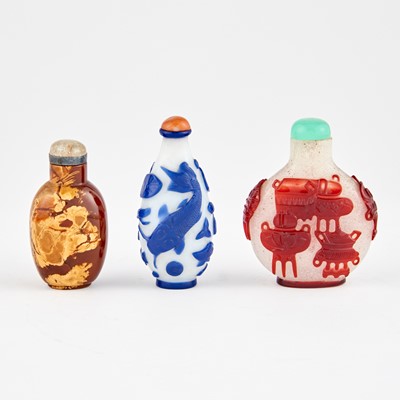 Lot 41 - A Chinese Realgar and Two Glass Overlay Snuff Bottles