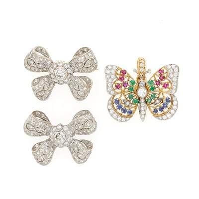 Lot 1182 - Pair of Two-Color Gold and Diamond Bow Pins and Diamond and Gem-Set Butterfly Enhancer