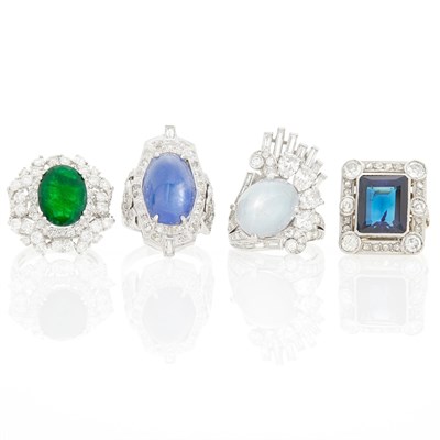 Lot 1069 - Four Platinum, Two-Color Gold, Star Sapphire, Cabochon Synthetic Sapphire, Emerald and Diamond Rings