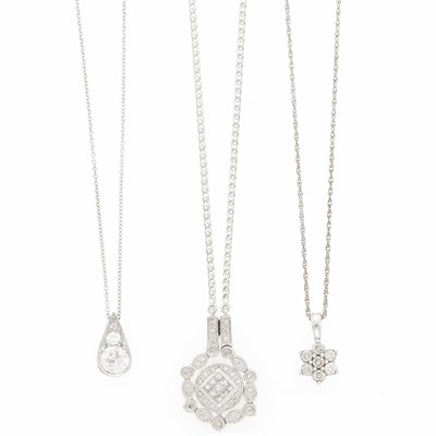 Lot 1076 - Three Platinum, White Gold, Low Karat Gold and Diamond Pendants with Chain Necklaces