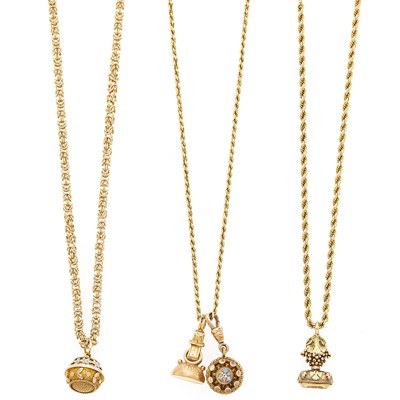 Lot 1071 - Three Gold and Low Karat Gold Fob Necklaces