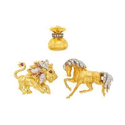 Lot 1123 - Two Two-Color Gold and Diamond Horse and Lion Brooches and Gold, Silver and Diamond Sack of Gold Charm