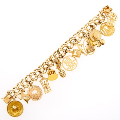 Lot 1084 - Gold and Silver-Gilt Charm Bracelet