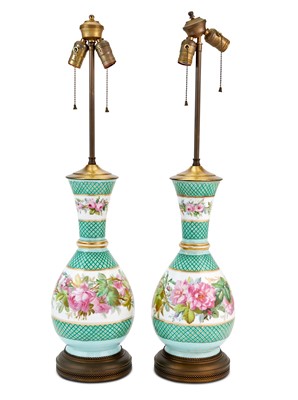 Lot 186 - Pair of Rose Decorated Bottle Form Porcelain Lamps