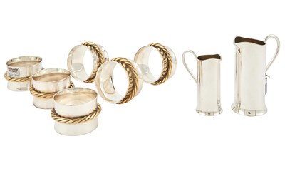 Lot 1077 - Three Cased Sets of Hermès Silver-Plated Napkin Rings and Hermes Silver Plated Milk and Cream Set