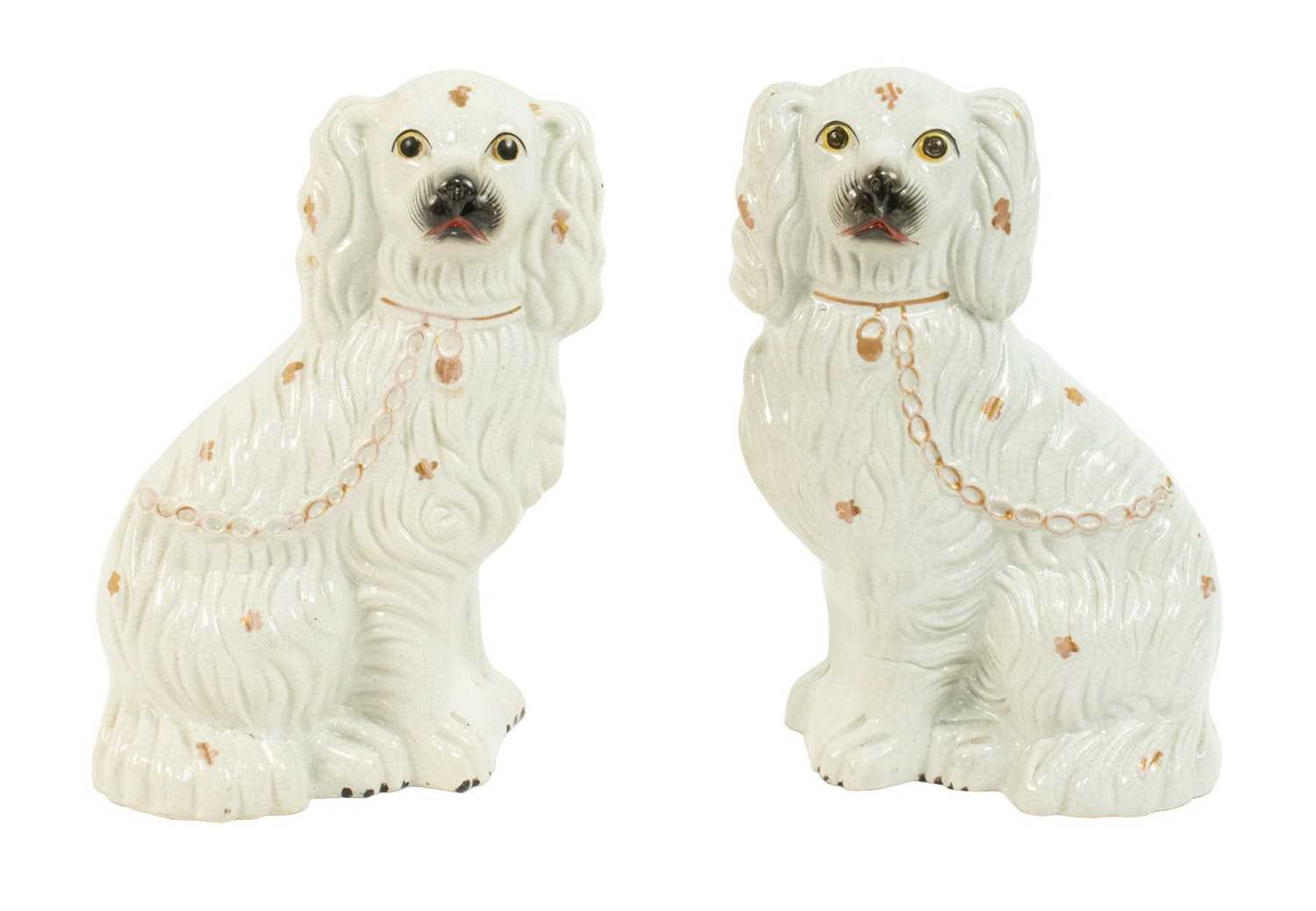 Pair of Staffordshire Pottery Dogs