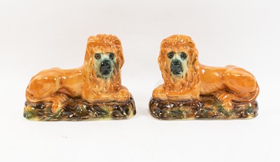 Lot 234 - Pair of Staffordshire Recumbent Lions