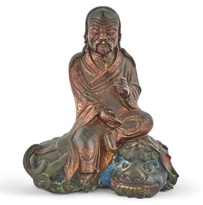Lot 517 - A Chinese Polychromed and Gilt Lacquered Bronze Seated Figure in Loose Robes