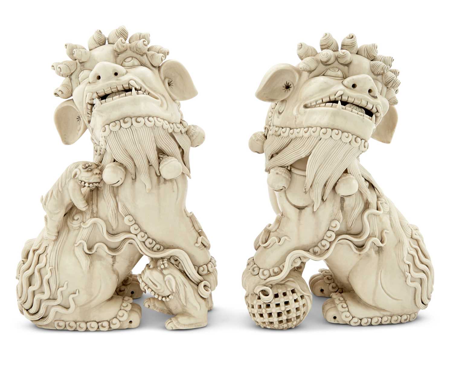 Lot 77 - A Pair of Chinese Dehua Porcelain Foo Dogs