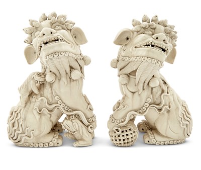 Lot 77 - A Pair of Chinese Dehua Porcelain Foo Dogs