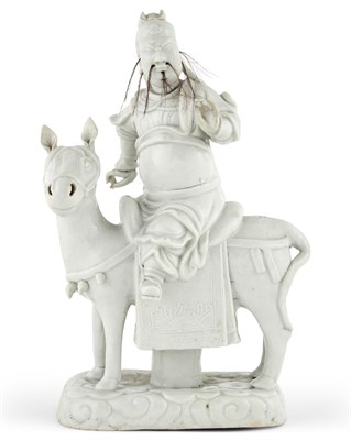 Lot 271 - A Chinese Dehua Porcelain Figure of Guan Yu on Horseback