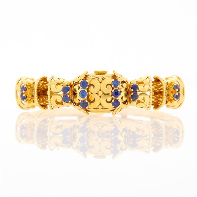 Lot 2056 - Gubelin Gold and Sapphire Bangle-Watch