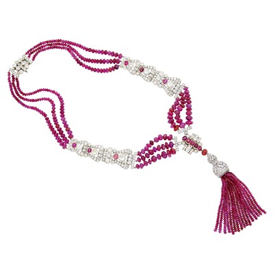 Lot 229 - Tiffany & Co. Triple Strand Ruby Bead, White Gold, Platinum, Diamond and Ruby Tassle Necklace, France