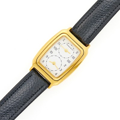 Lot 1281 - Tiffany & Co. Gold Dual Time Wristwatch