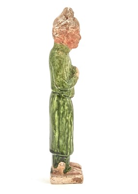 Lot 105 - A Chinese Green Glazed Pottery Figure of a Standing Attendant