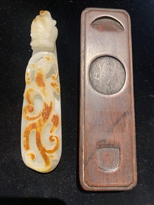 Lot 20 - A Chinese White and Russet Jade Belt Hook
