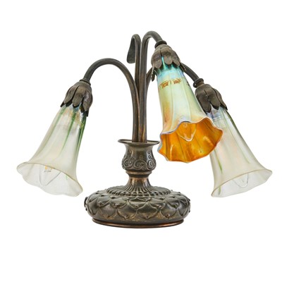 Lot 511 - Tiffany Studios Bronze and Favrile Glass Three-Light Pond Lilly Piano Lamp