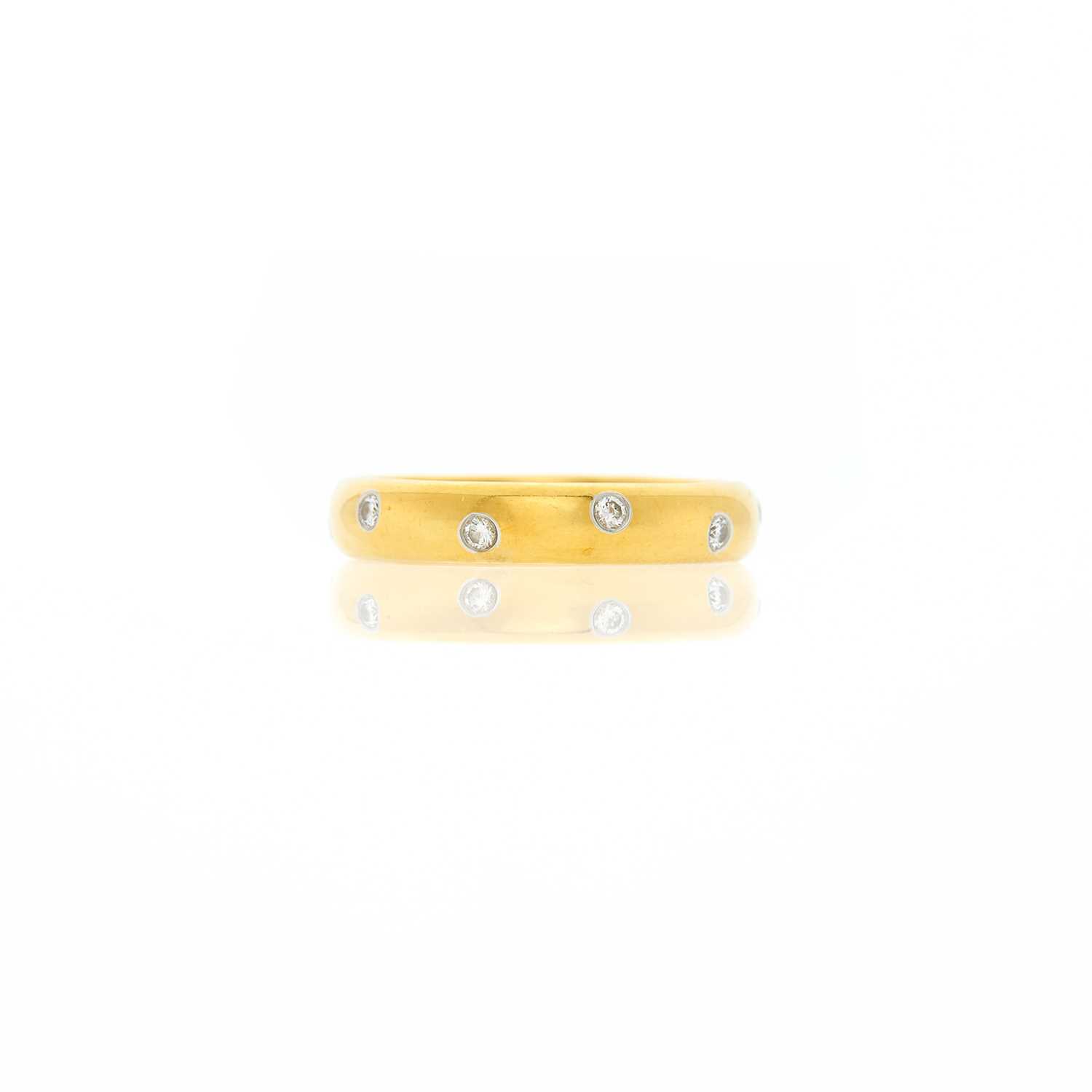 Lot 1006 - Tiffany & Co. Gold, Platinum and Diamond 'Etoile' Band Ring