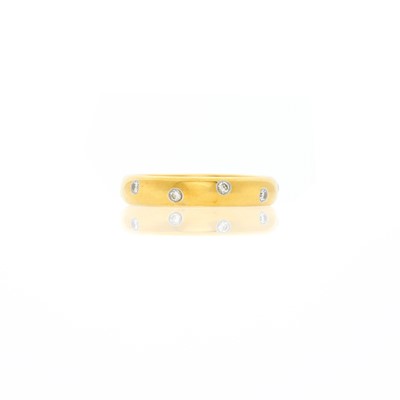 Lot 1006 - Tiffany & Co. Gold, Platinum and Diamond 'Etoile' Band Ring