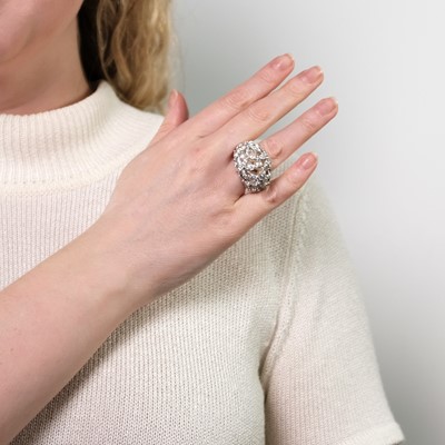 Lot 70 - Mikimoto White Gold, Cultured Pearl and Diamond Flower Bombé Ring, France