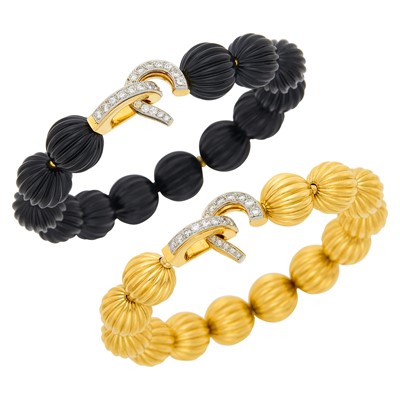 Lot 184 - Cartier Pair of Gold, Platinum, Fluted Black Onyx and Gold Bead and Diamond Bracelets, France